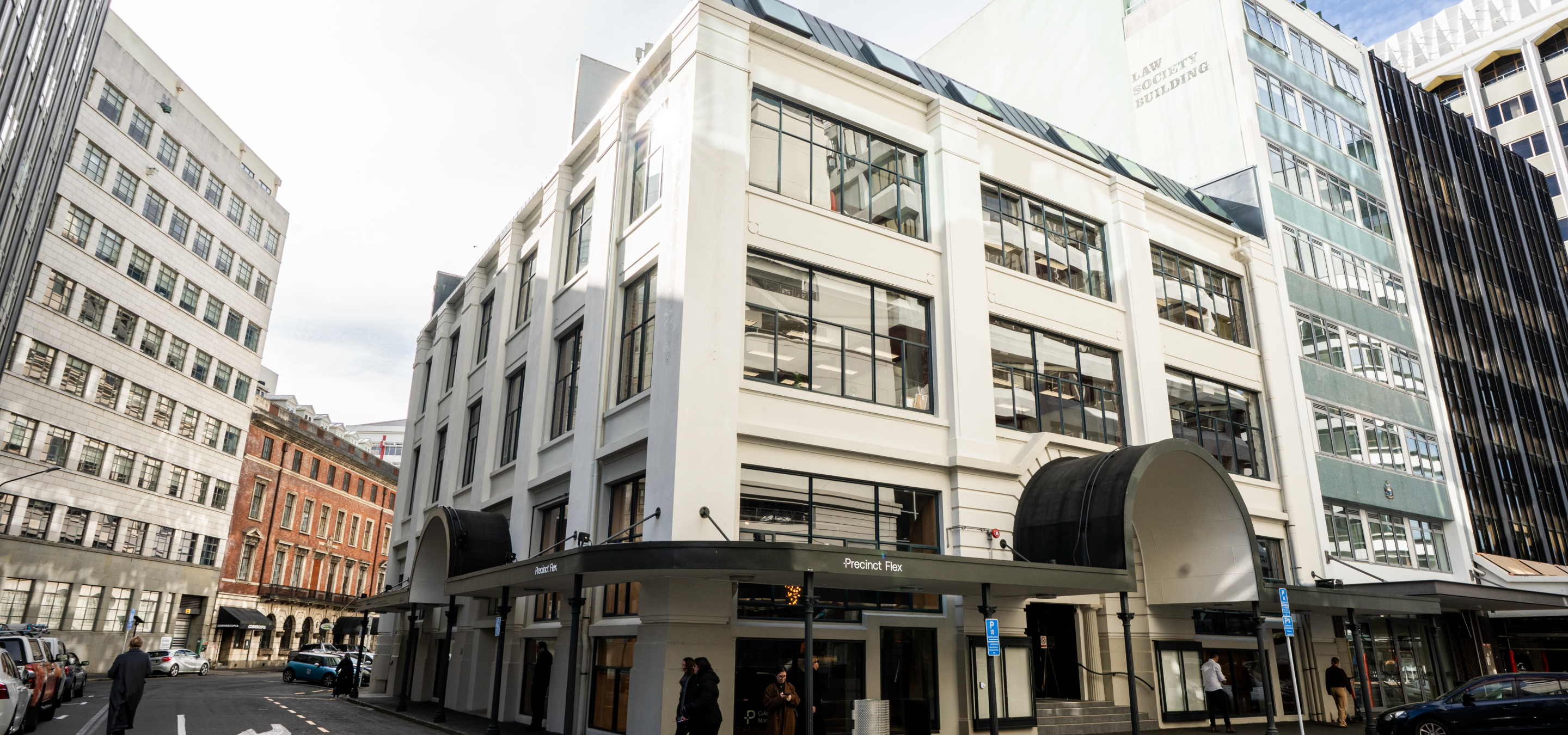 The refurbished Art Deco exterior of 30 Waring Taylor St by Precinct Flex in Wellington, home to contemporary co-working and event spaces.