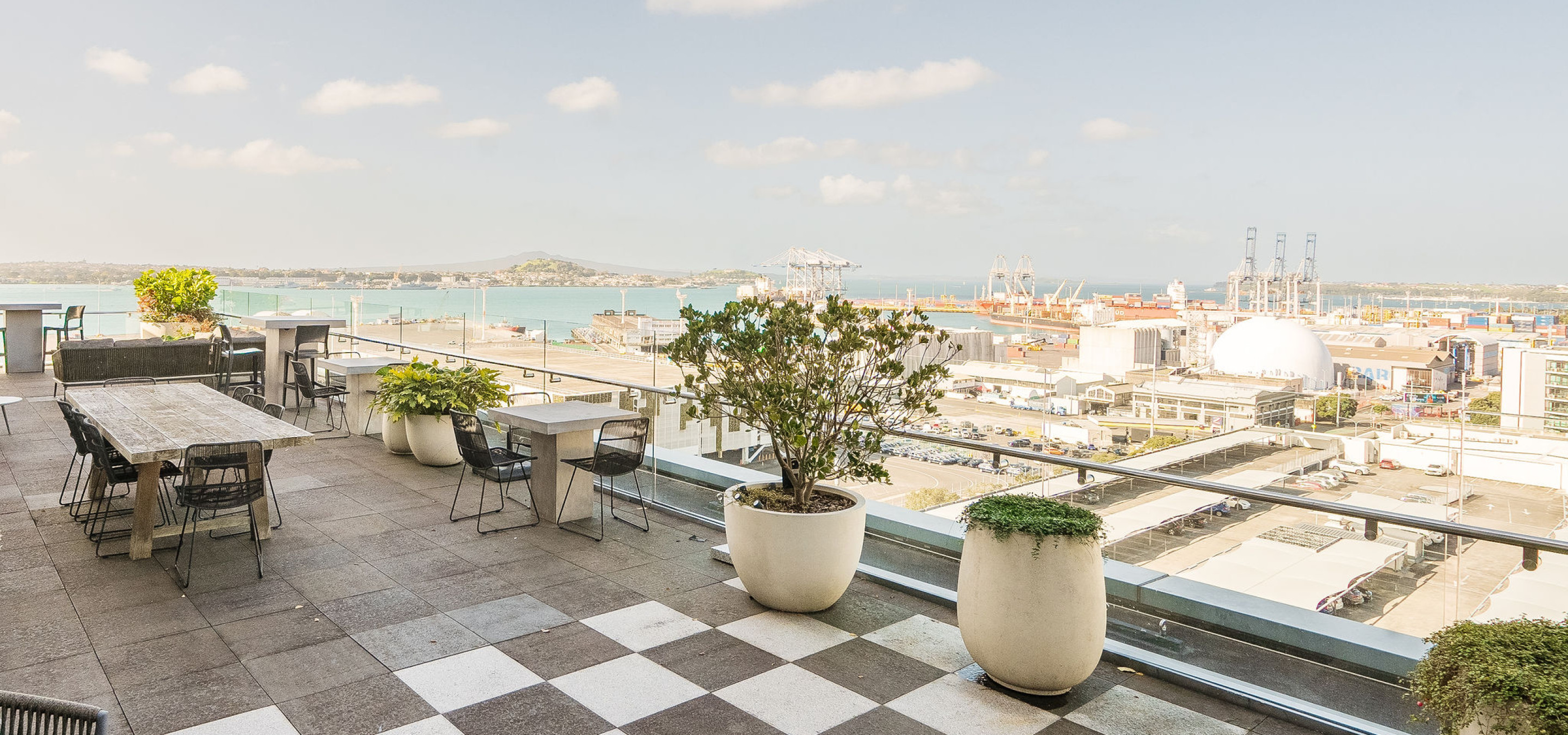 This modern, stylish rooftop terrace at Britomart Place by Precinct Flex, Auckland, overlooks the Waitematā Harbour.