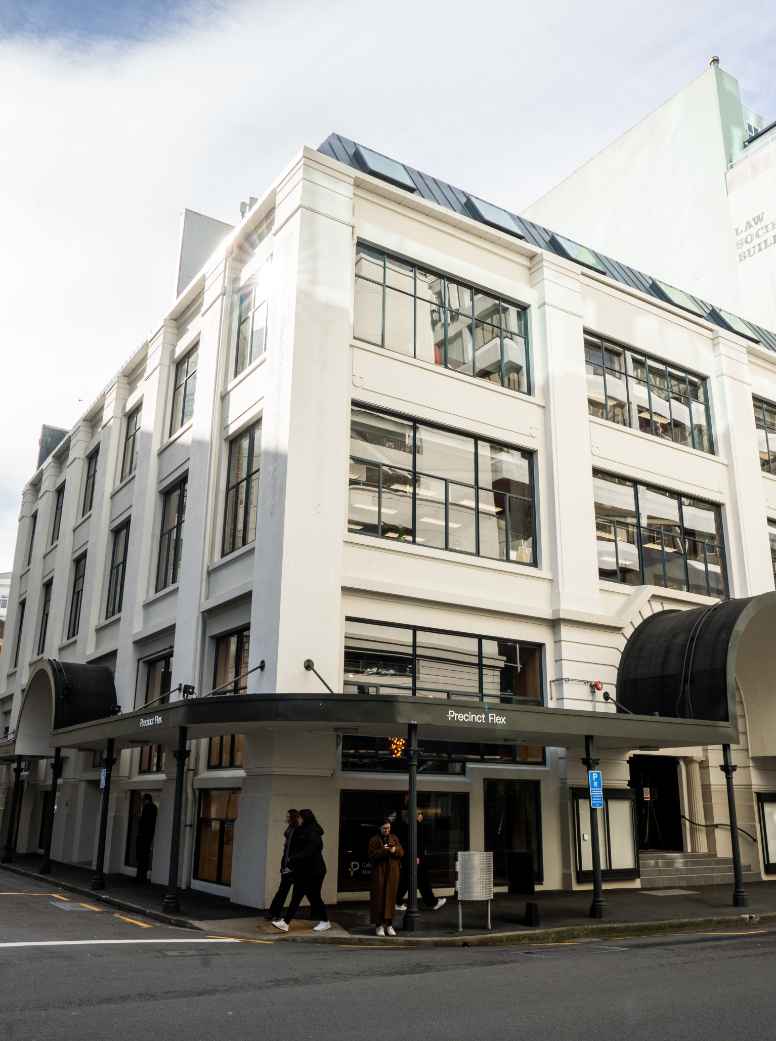 The refurbished Art Deco exterior of 30 Waring Taylor St by Precinct Flex in Wellington, home to contemporary co-working and event spaces.
