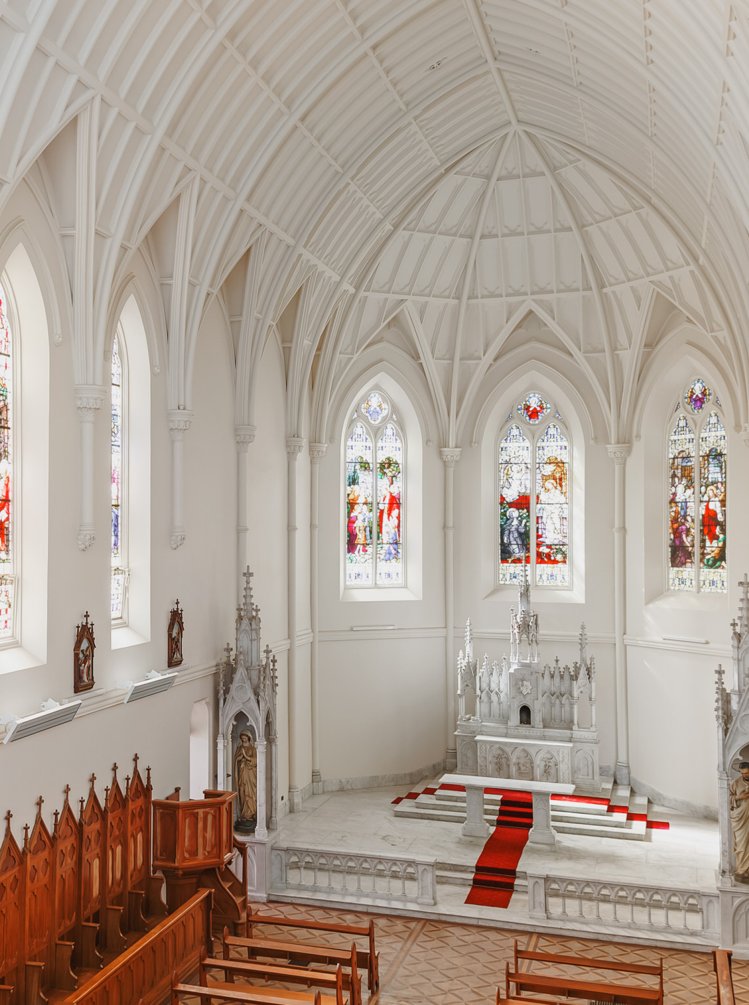 Wellington's Erskine Chapel showcases its exquisite French Gothic interior with stunning stained glass windows and a vaulted ceiling.