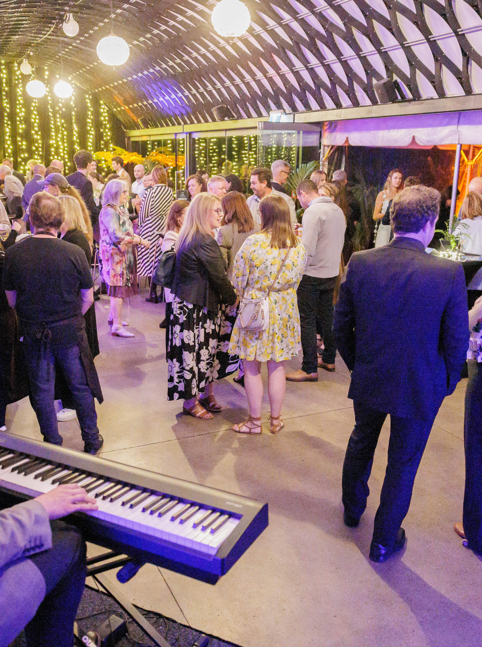Guests enjoy live music and mingle in the barrel-vaulted Kamala's event pavilion at Te Nukuao Wellington Zoo.