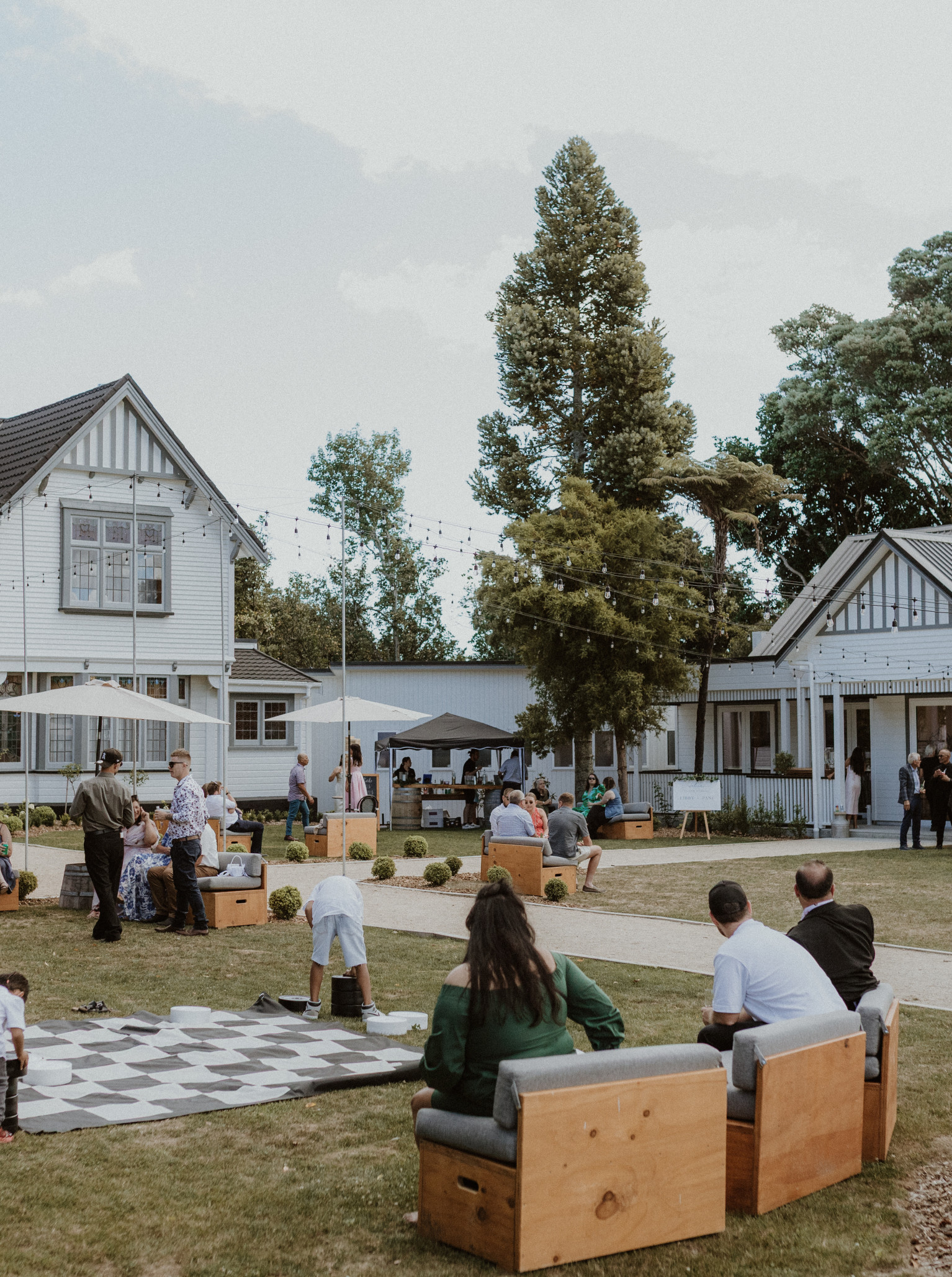 A vibrant outdoor gathering with games on the lawn at Tatum, a historic homestead venue in Manawatū-Whanganui.