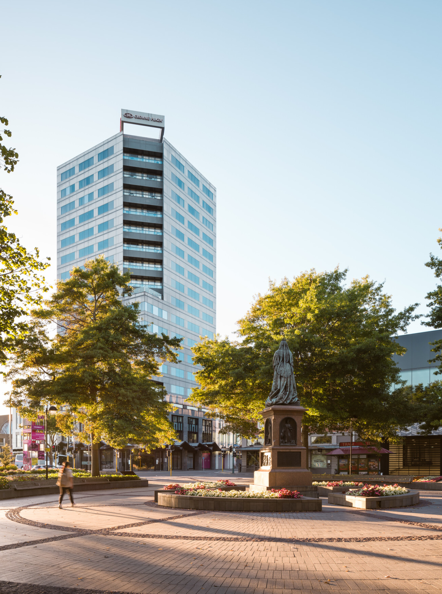 The Crowne Plaza Christchurch, a modern high-rise hotel, is prominently situated overlooking Victoria Square.