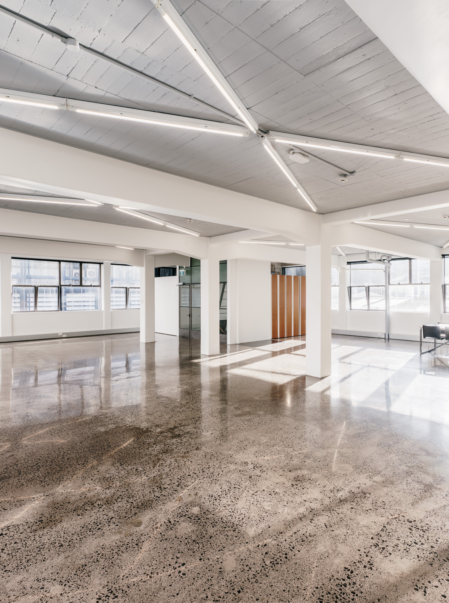 The Tuesday Club in Auckland offers a bright, industrial-chic gallery space with polished concrete floors and abundant natural light.