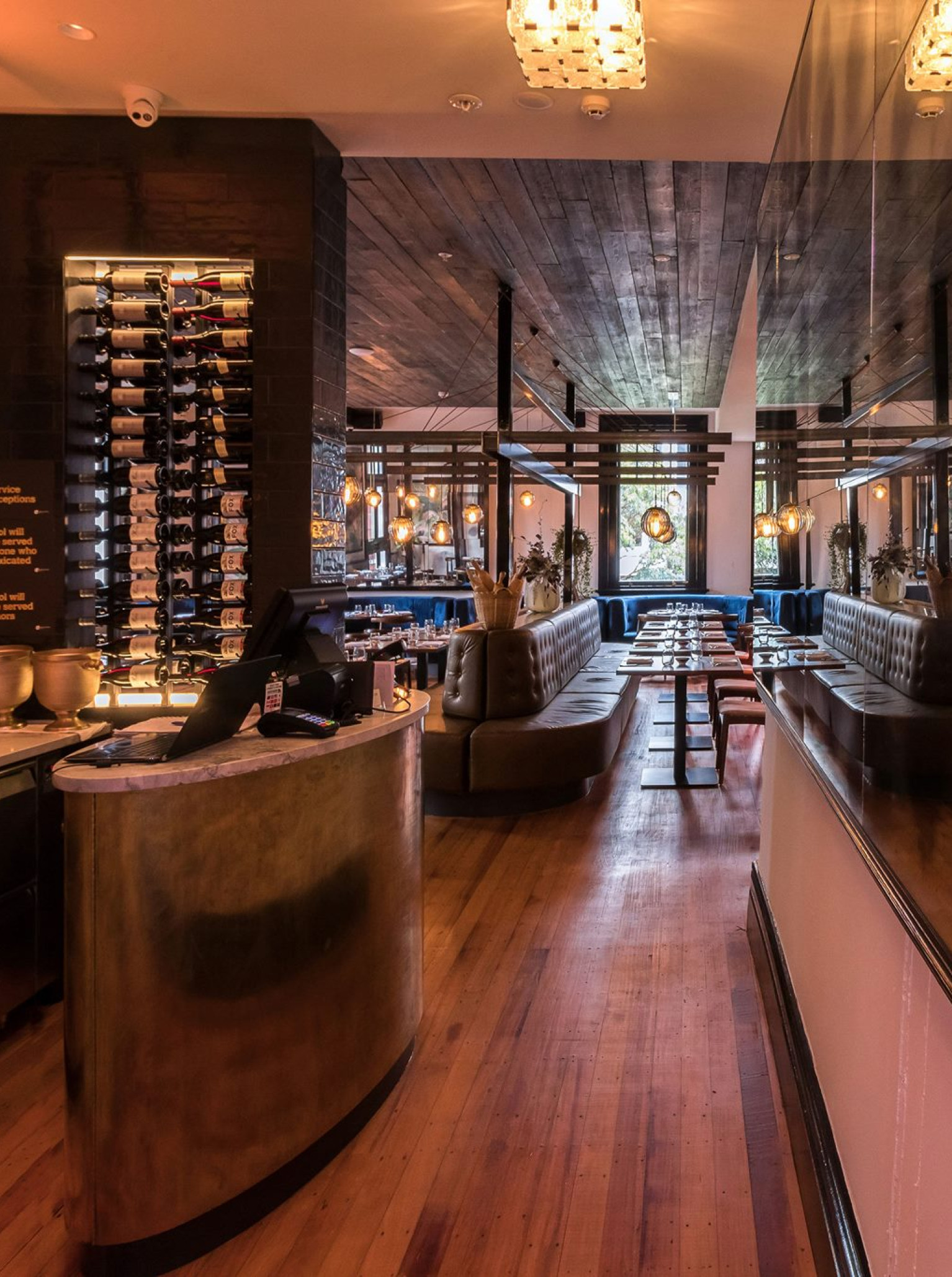 The modern European-inspired dining room at Clarence Bistro, Tauranga, features warm lighting and rich textures.