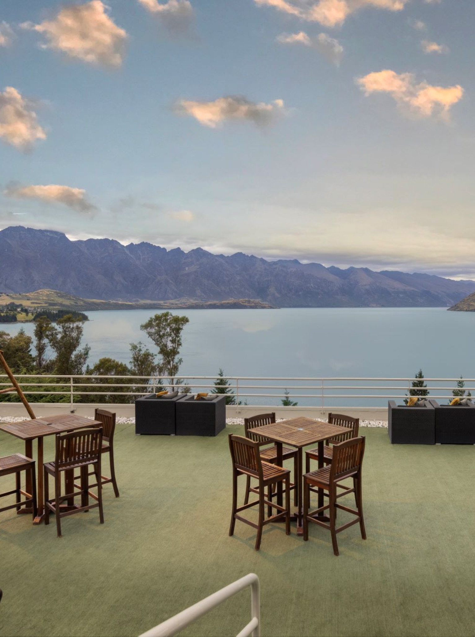 Mercure Queenstown Resort's contemporary alpine terrace offers stunning views of Lake Wakatipu and the Remarkables.