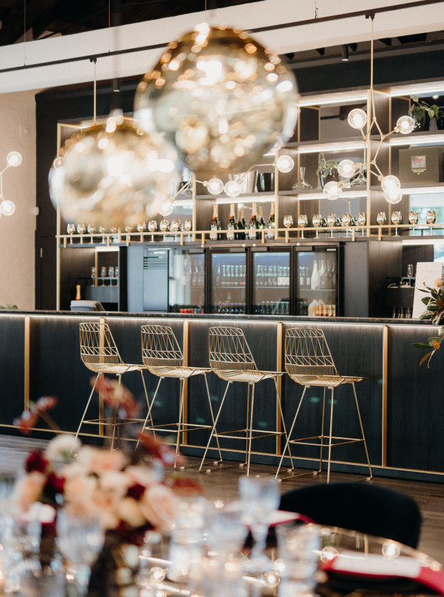 A contemporary and stylish event bar area with gold accents, designed by Darby & Grey Event Hire in Auckland.