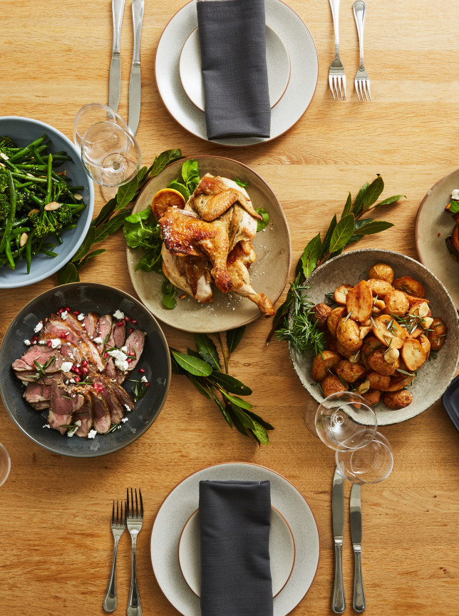 A contemporary dining table laden with Great Catering's innovative and beautifully presented dishes in Auckland.