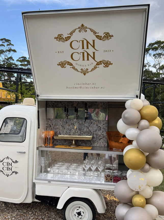 Cin Cin Mobile Bar, an elegant Italian Piaggio Apé, serves drinks outdoors in Auckland.