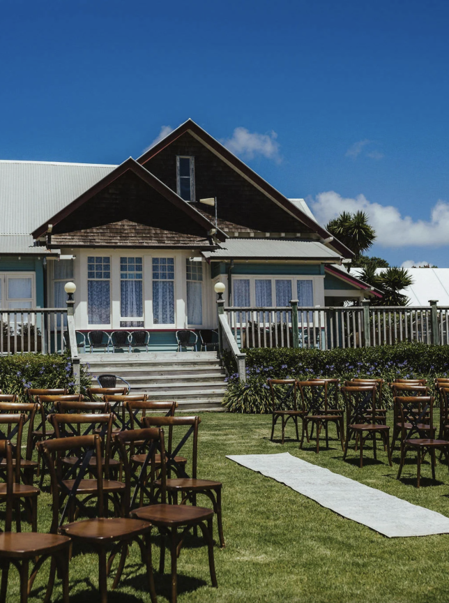 An outdoor ceremony on the lawn of Connemara Country Lodge, a beautifully restored grand country homestead in Auckland.