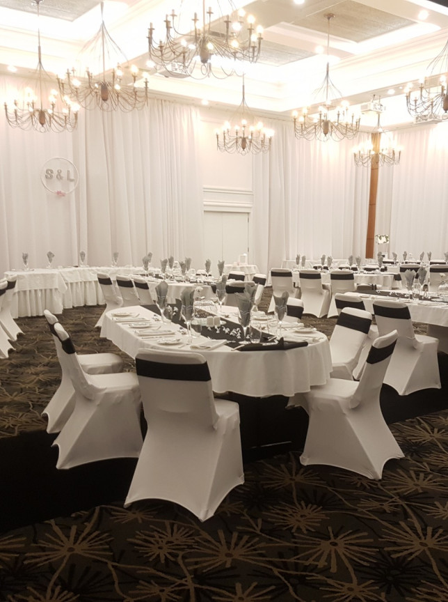 Plymouth International, New Plymouth's contemporary ballroom, elegantly prepared for a banquet with white and black decor.