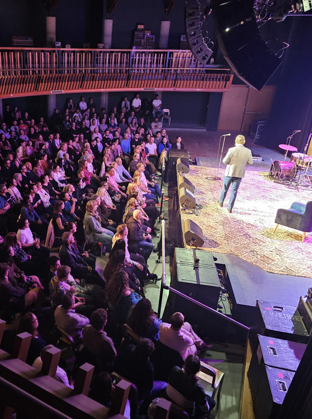 Audience seated in the modern Meow Nui music venue in Wellington, enjoying a performance from the mezzanine and main floor.