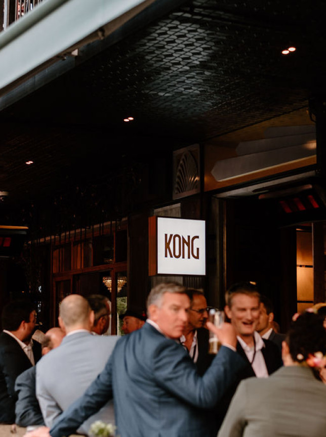 People socialize on the outdoor terrace of Kong, a 1930s-inspired Art Deco cocktail bar in Christchurch.