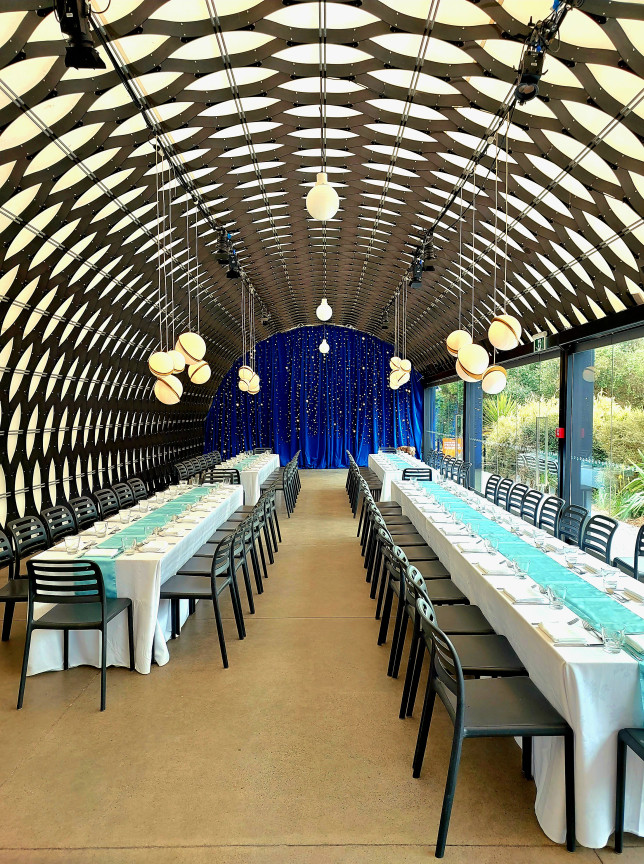Kamala's, an architecturally award-winning event space at Te Nukuao Wellington Zoo, featuring a distinctive arched ceiling and banquet setup.