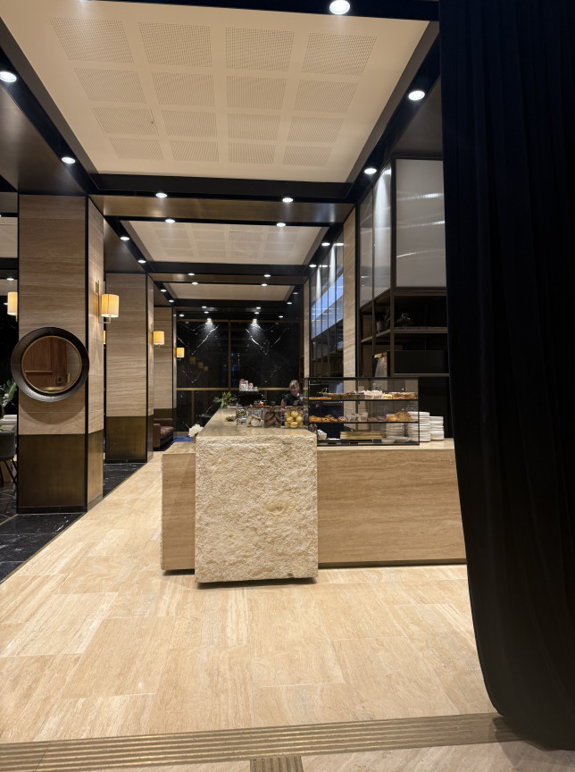Deschlers on Queen, Auckland, features a sophisticated pastry and coffee counter with elegant marble and stone finishes.
