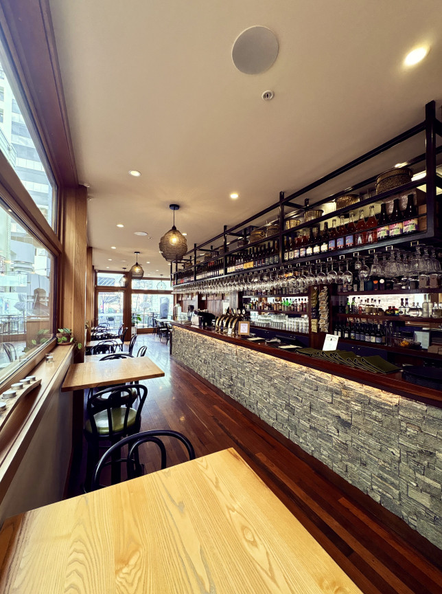 An intimate, industrial-chic bar and dining room at Amador at Press Hall, Wellington.