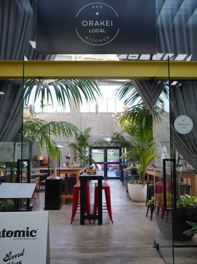 Orakei Local, Auckland offers a stylish, plant-filled modern bar and kitchen interior with a relaxed vibe.