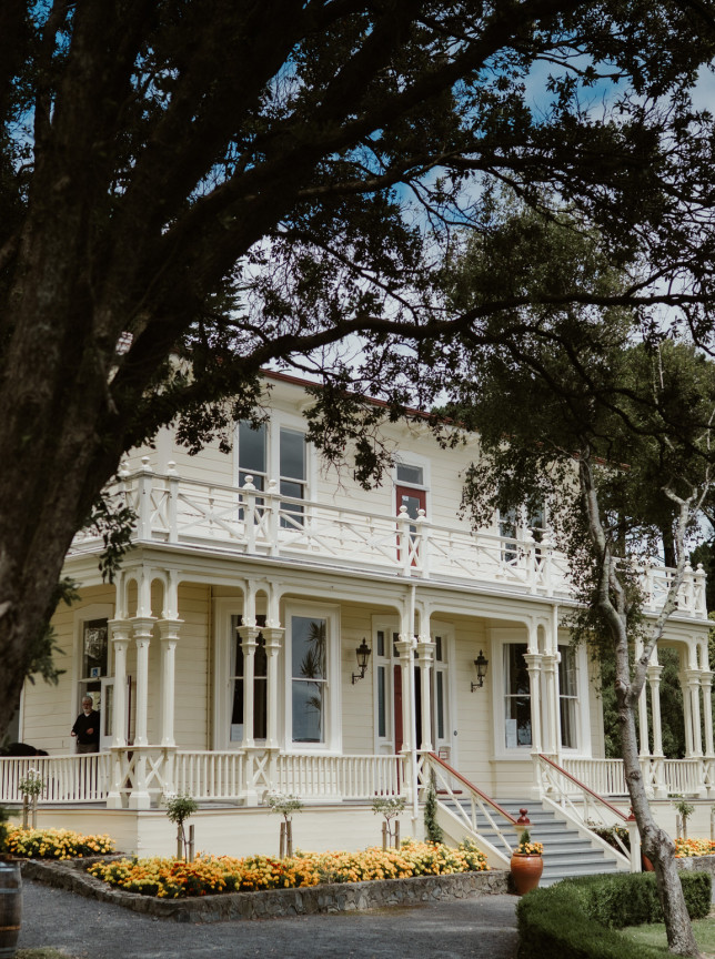 Exterior view of the elegant Victorian-style Gear Homestead, a historic two-story timber venue in Wellington, New Zealand.