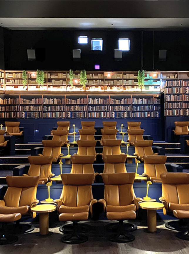 A chic, library-themed boutique cinema at Event Cinemas Westfield Newmarket, Auckland, featuring tiered seating and plush recliners.