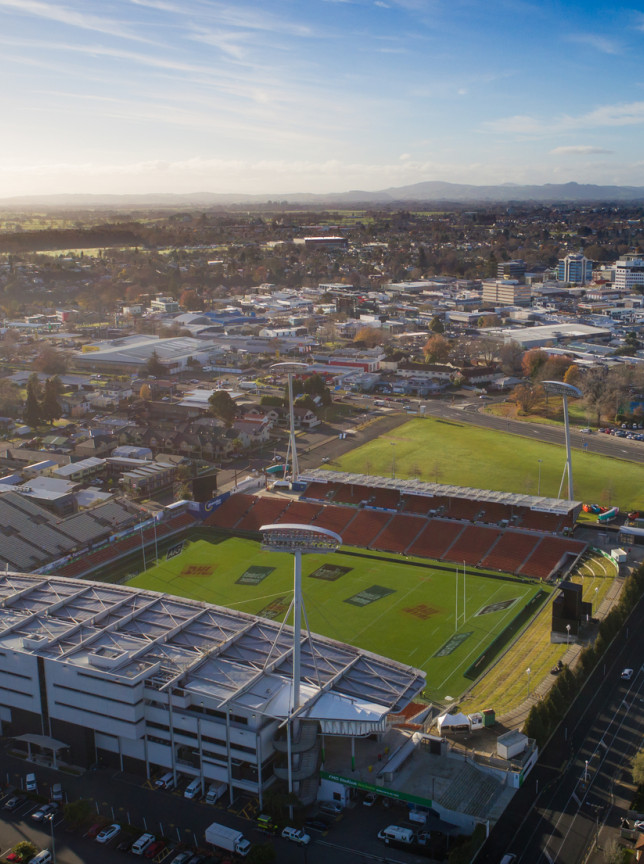 An aerial view showcases FMG Stadium Waikato, a modern international sports stadium in Hamilton.