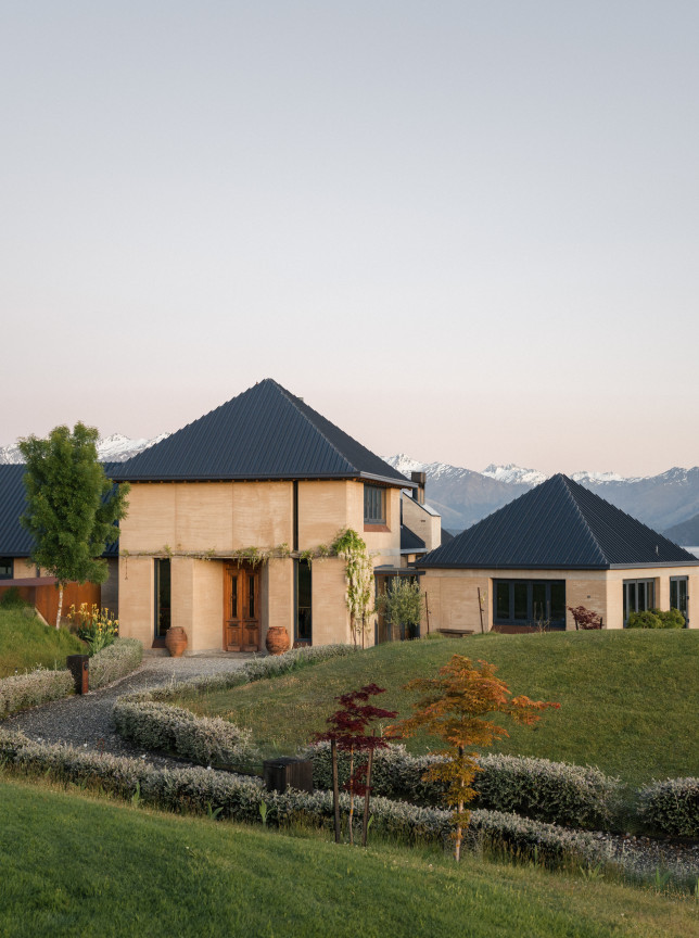 The Rippon Hall, a rammed earth and timber event venue in Wanaka, offers panoramic views of Lake Wanaka and mountains.