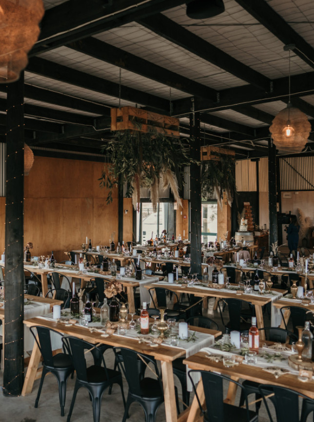 The rural-style barn at Tironui, Rotorua, provides an inviting indoor dining area.