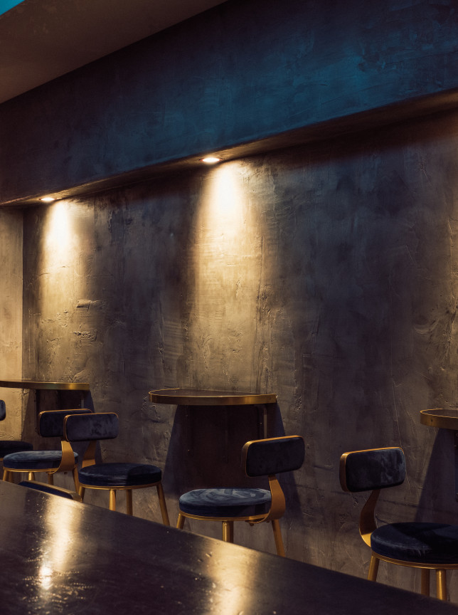 Intimate bar seating with moody lighting in the modern underground New York-style ambiance of Thursday Bar, Auckland.