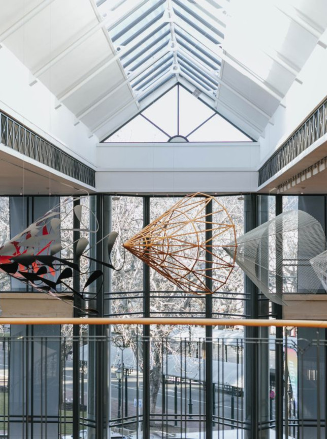 Suspended modern art installations inside the architecturally striking, high-ceiling atrium of the Dunedin Public Art Gallery in Dunedin.