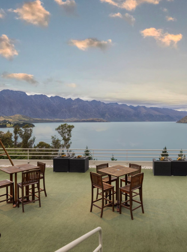 Mercure Queenstown Resort's contemporary alpine terrace offers stunning views of Lake Wakatipu and the Remarkables.