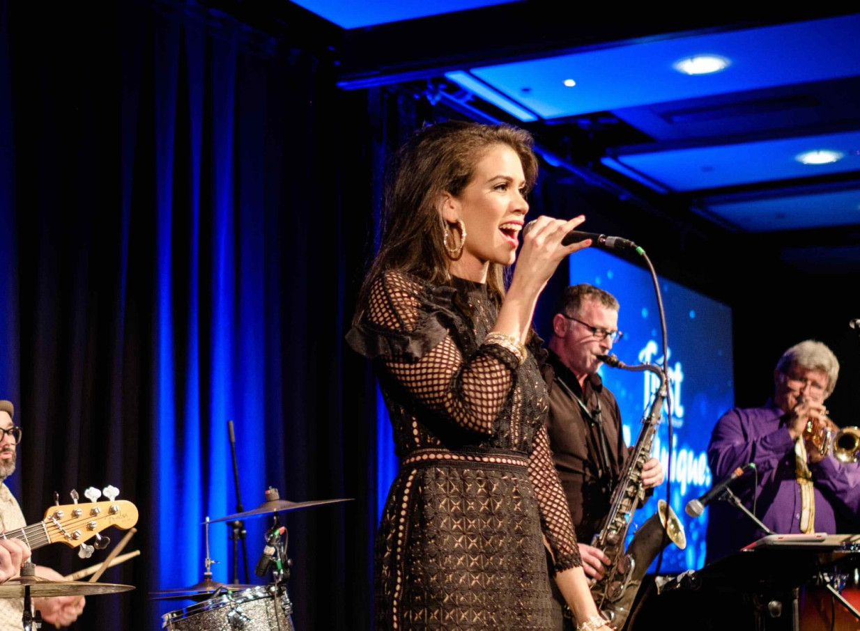 A live band with a vocalist performing, typical of the quality entertainment supplied by Auckland's Findaband.