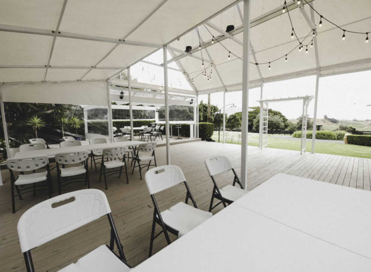 The country-style Connemara Country Lodge, Auckland, offers an elegant permanent marquee for outdoor events, complete with seating.