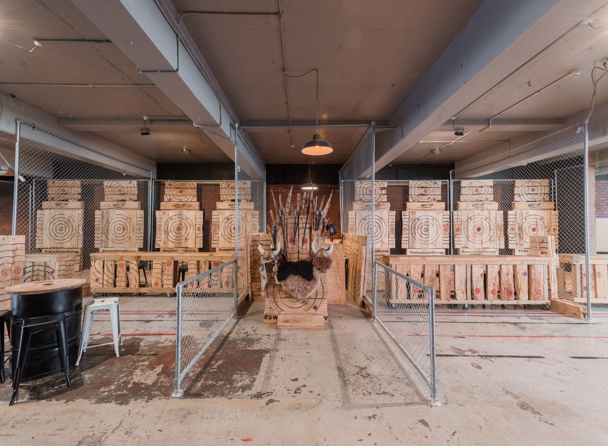 An industrial New-York loft style axe throwing range at Whisky & Wood, Wellington.