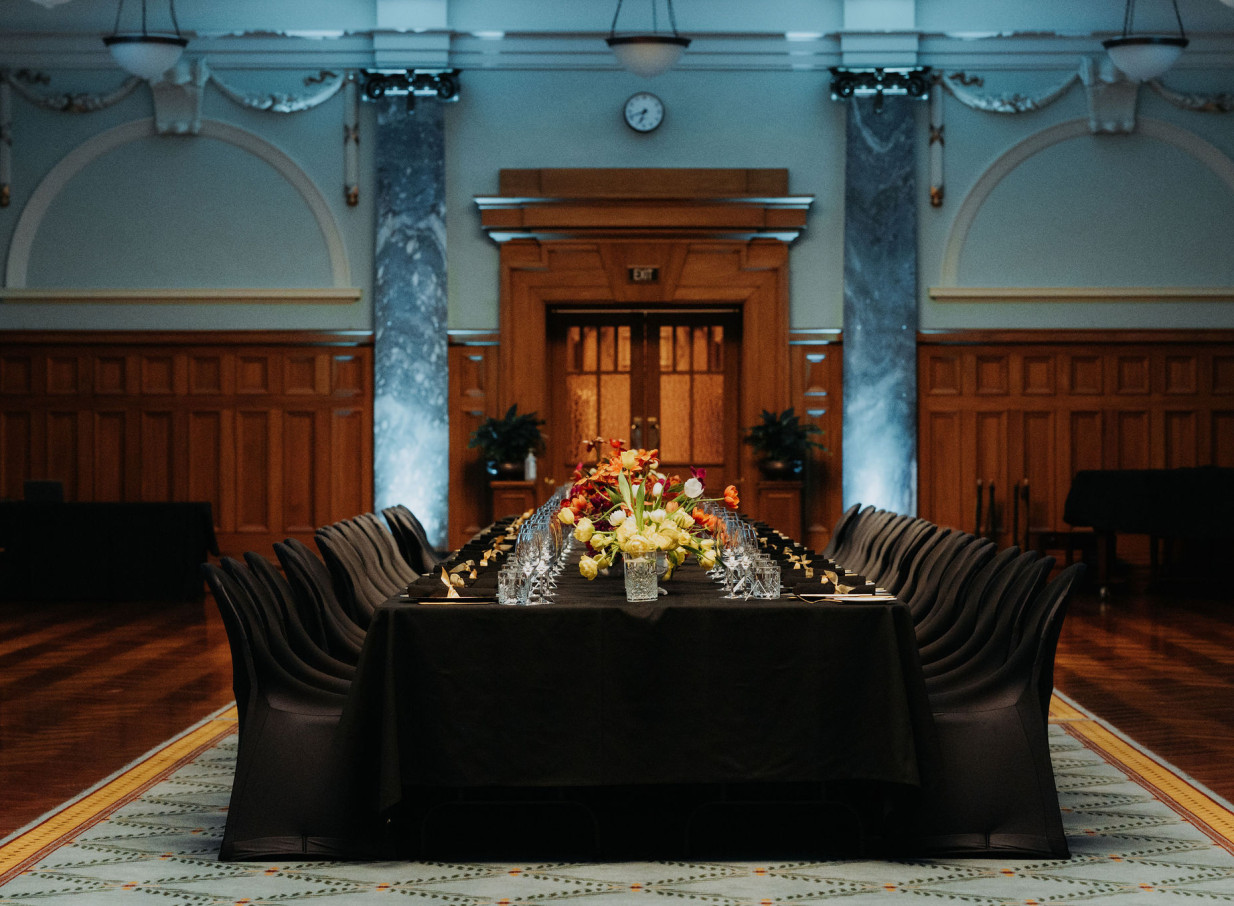 An elegant dinner setup in the grand, Edwardian neoclassical Parliament Buildings hosted by Huihui, Wellington.