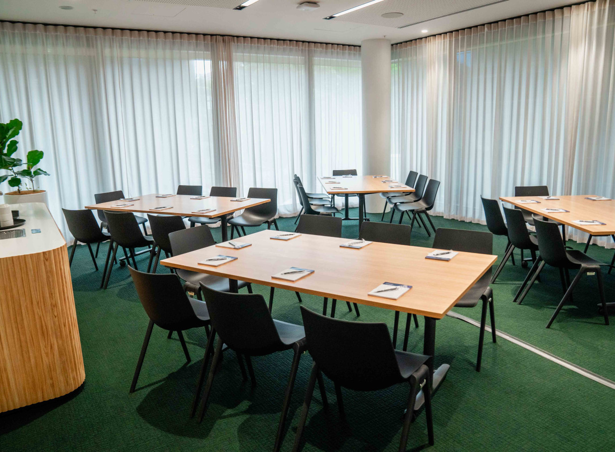 This modern, light-filled meeting room at Wellington's Bowen Campus by Precinct Flex features adaptable layouts for events.