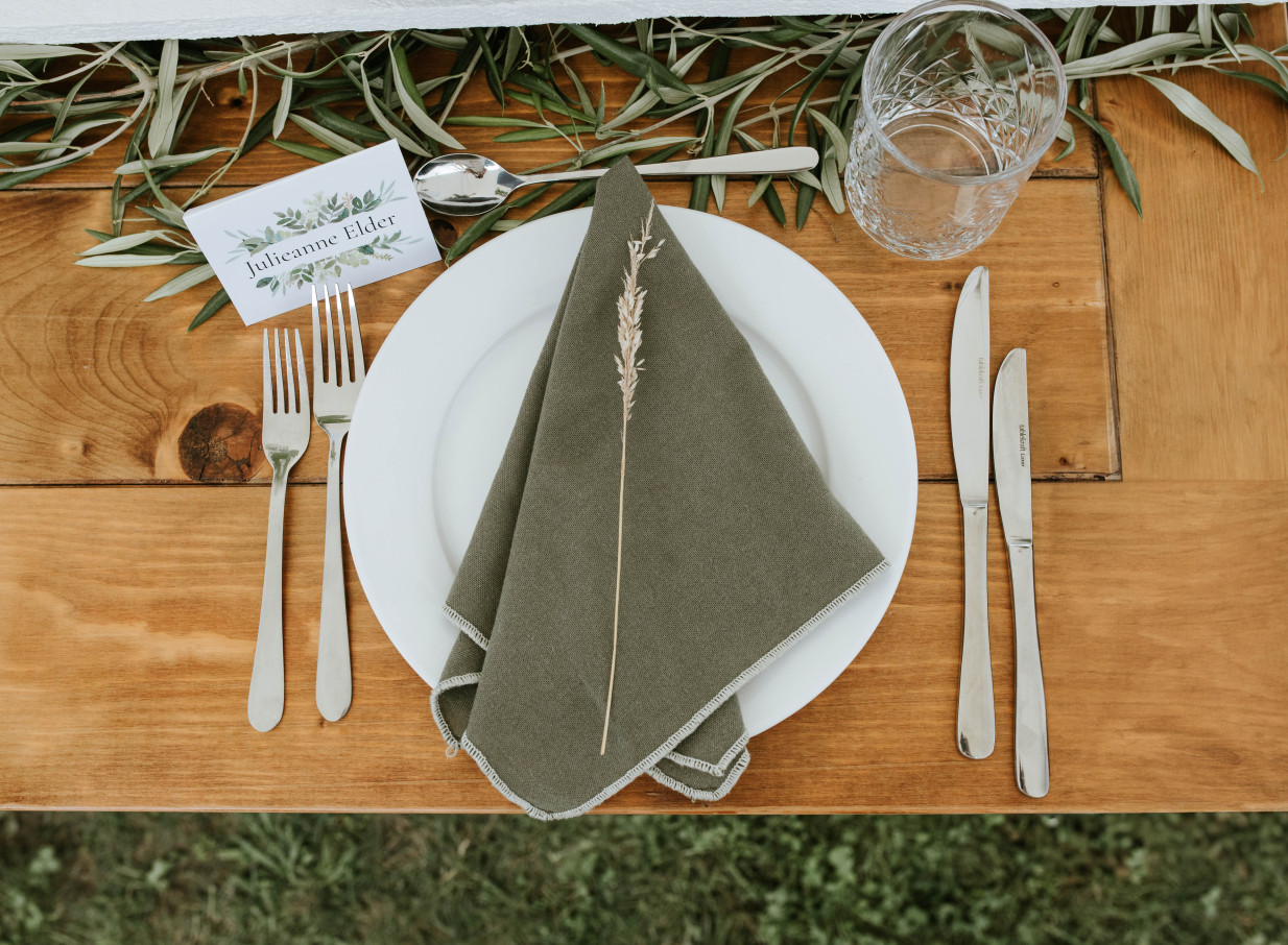 This elegant rustic place setting at Te Karaka Lodge, Waikato, embodies its modern farmstay design with natural touches.
