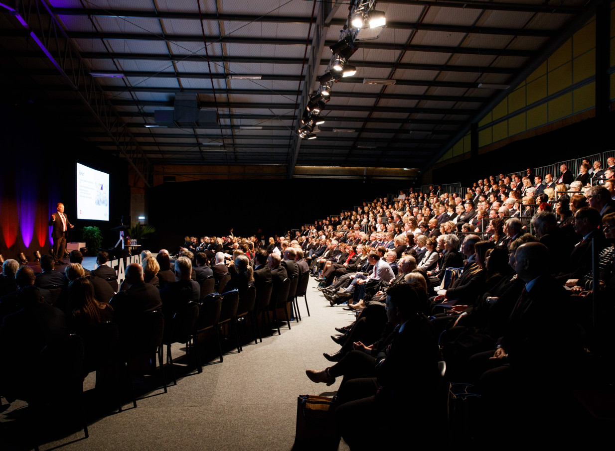 A presentation is underway in a large-scale event space at the modern multi-purpose Central Energy Trust Arena in Palmerston North.