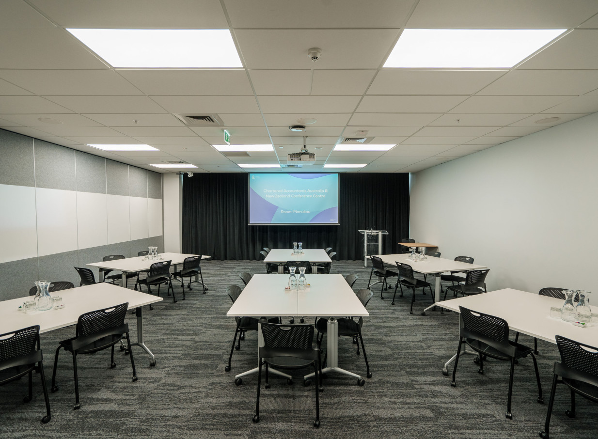 A classroom-style conference room with a modern and intuitive design at the CA Auckland Conference Centre in Auckland.