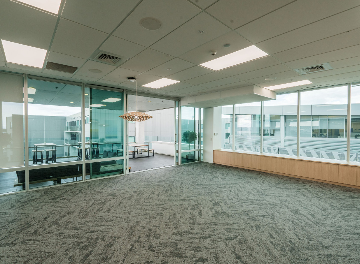 The CA Auckland Conference Centre in Auckland features a modern, versatile meeting room with an adjoining outdoor balcony.