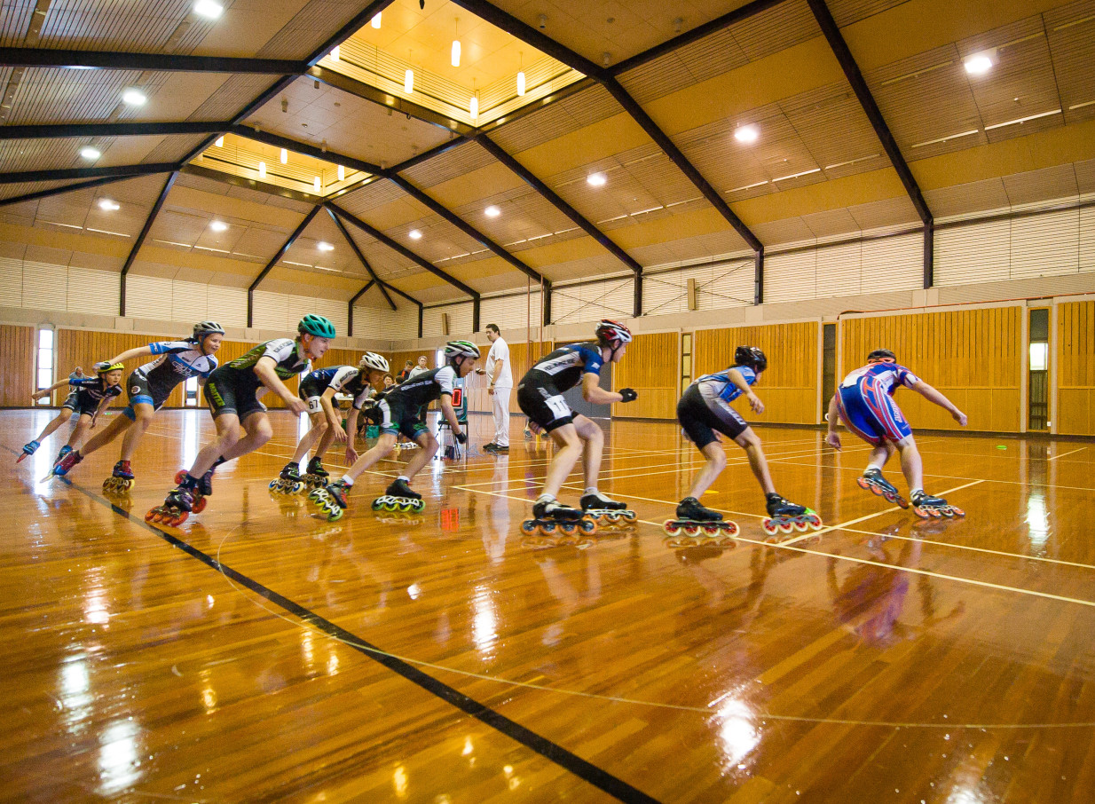 An indoor rollerblading race takes place in the modern Recreation Hall at Whirinaki Whare Taonga in Upper Hutt.