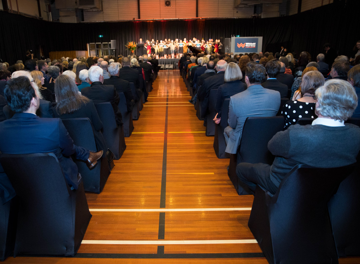 A seated audience enjoys an event in the contemporary Professionals Recreation Hall at Whirinaki Whare Taonga in Upper Hutt.