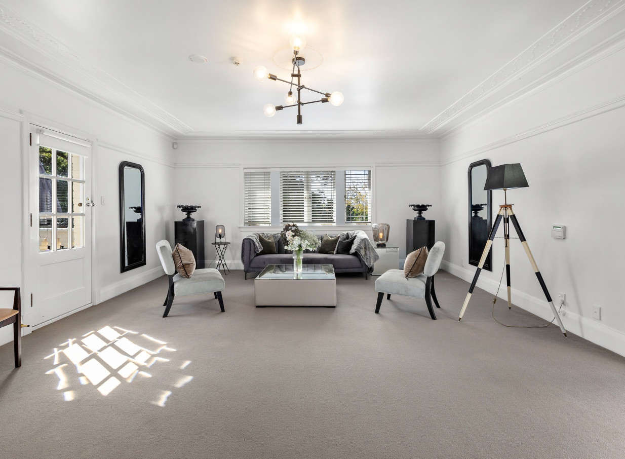 An elegant lounge area within Puketutu Island Estate, a Spanish-style homestead in Auckland.