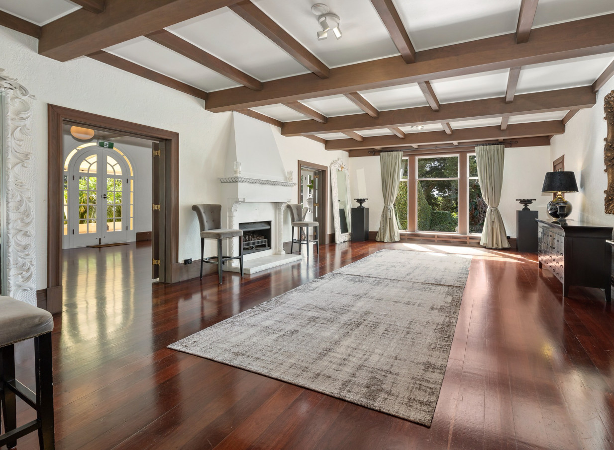 An elegant Spanish Mission-style reception room at Puketutu Island Estate, Auckland.