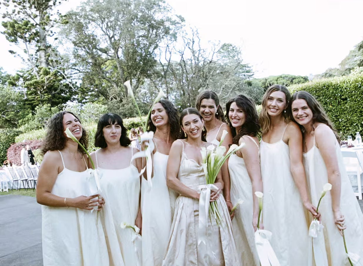 An outdoor celebration in the beautiful gardens of The Arts House Trust at Pah Homestead, an Italianate-inspired venue in Auckland.