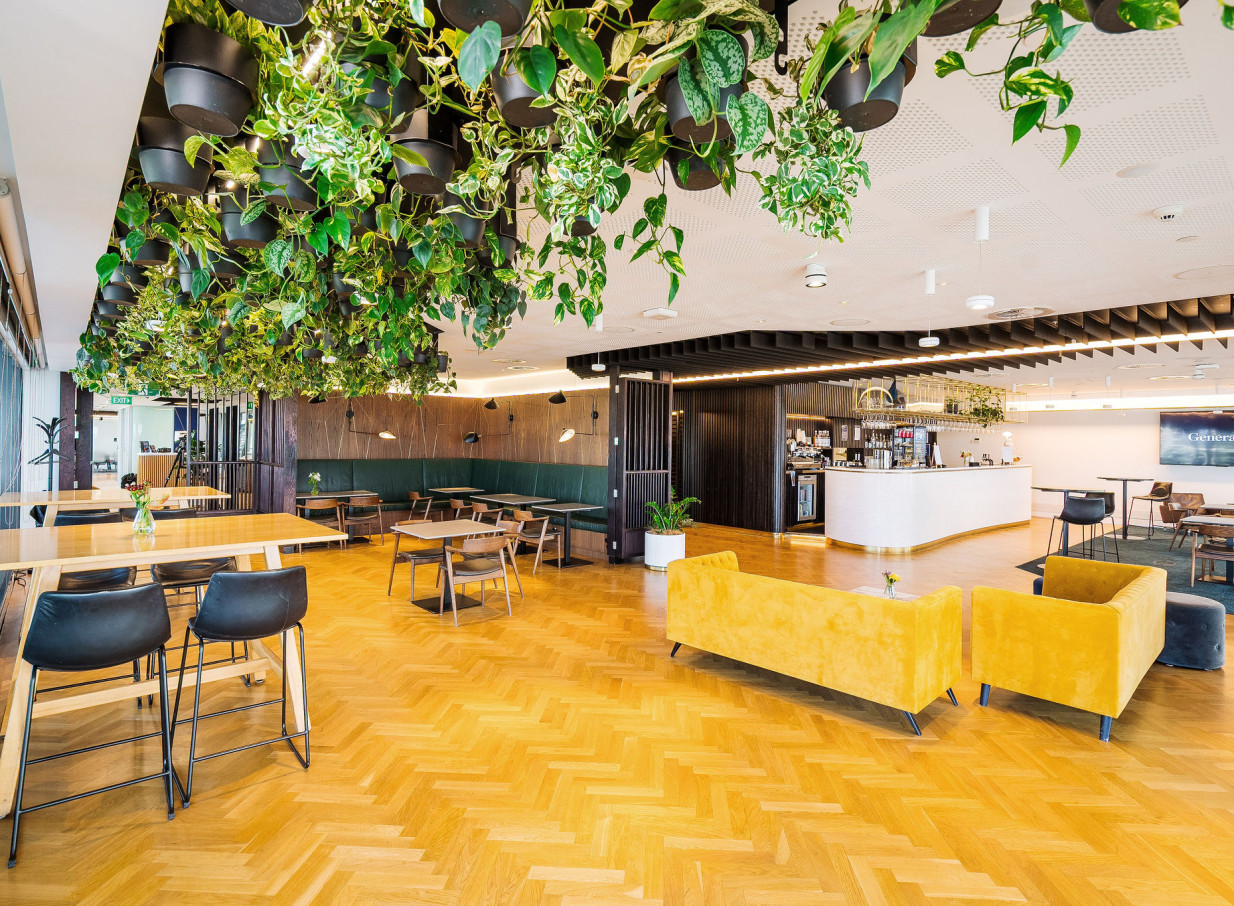 Britomart Place by Precinct Flex in Auckland presents a stylish, plant-filled lounge and bar area.