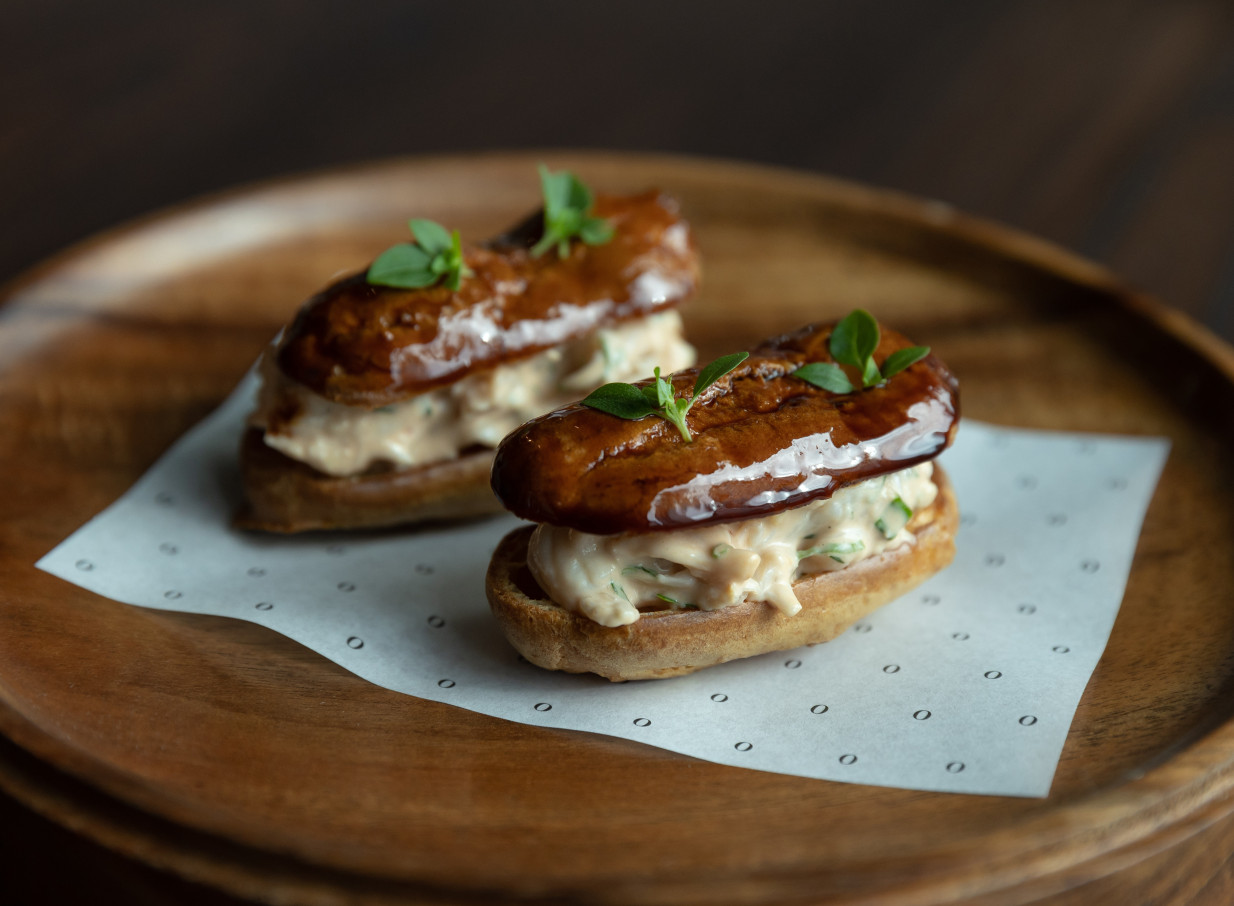Two savory éclairs, a modern interpretation of a classic dish at Onslow, a sophisticated restaurant in Auckland.
