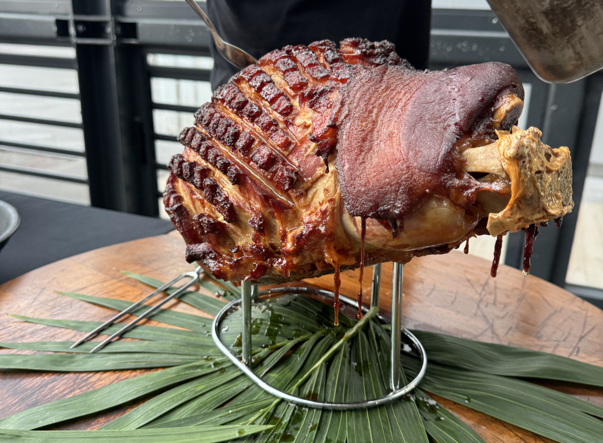 Roasted pork hock being served at Wharfside Function Centre, a stylish waterfront event venue in Auckland.