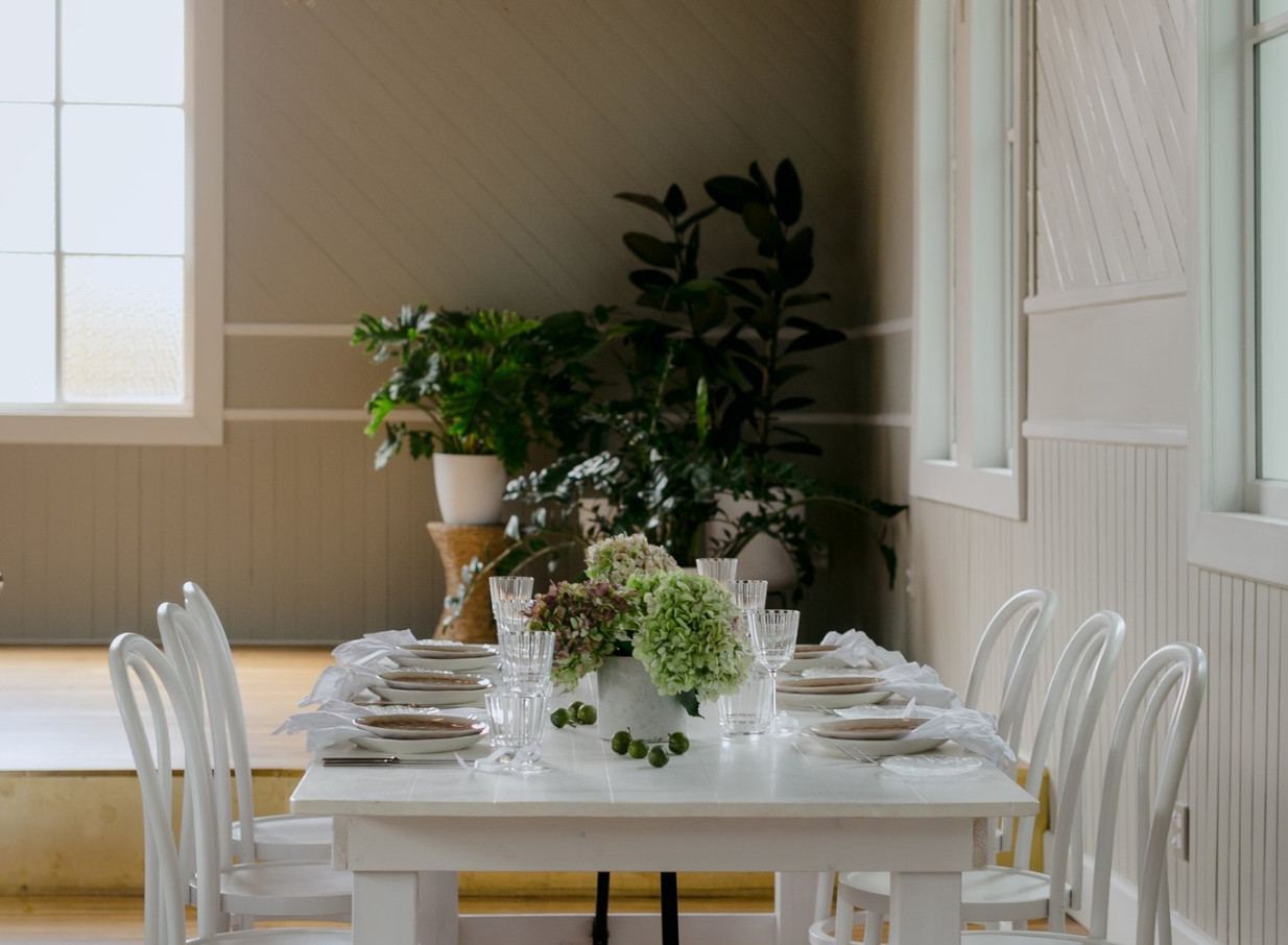 A bright, elegant event table in the charming, restored historic Waikākā Church in Queenstown, blending heritage and modern design.