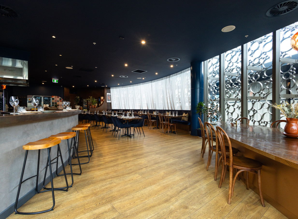 Bar Franco in Christchurch features a modern Italian dining room and bar, accented by elegant decor and large windows.