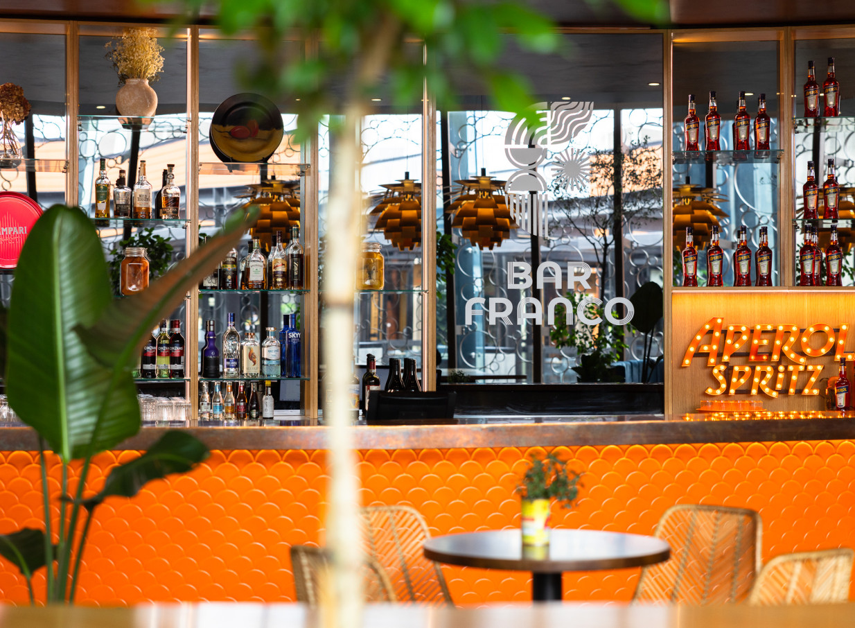 The vibrant, retro-inspired bar at Bar Franco in Christchurch embodies a modern Italian and Mediterranean aesthetic.