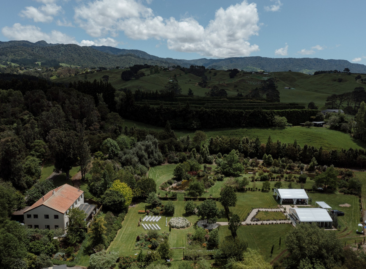 An outdoor wedding ceremony and marquee reception at Villa Vie, a French country estate in Bay of Plenty.